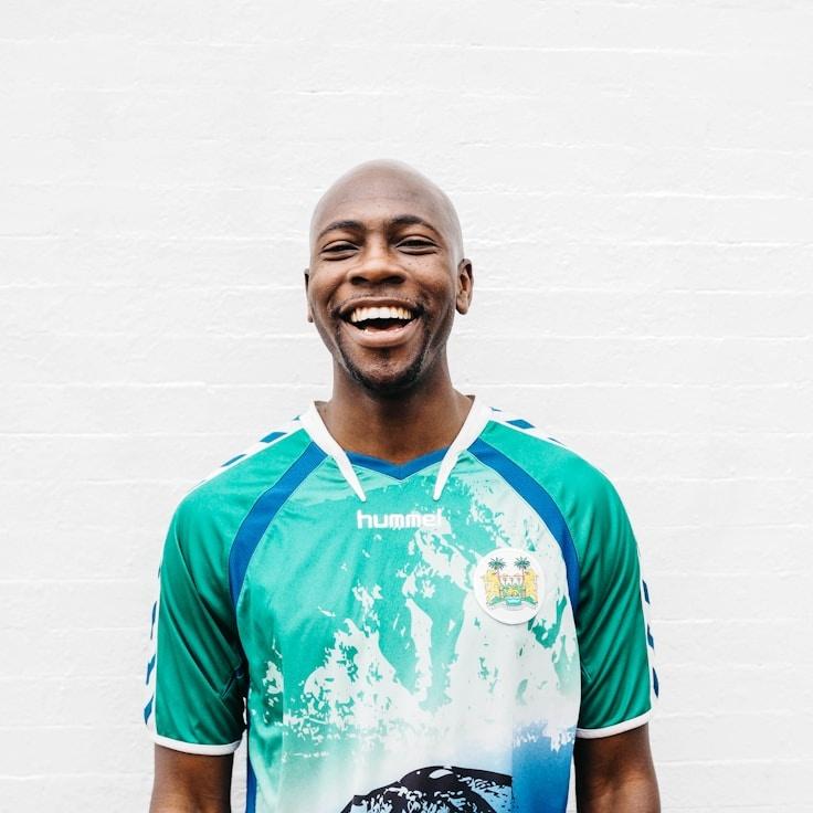 Avery Chen, Lead Design Curator at Natural Mind Concepts, reviewing corporate floral arrangements